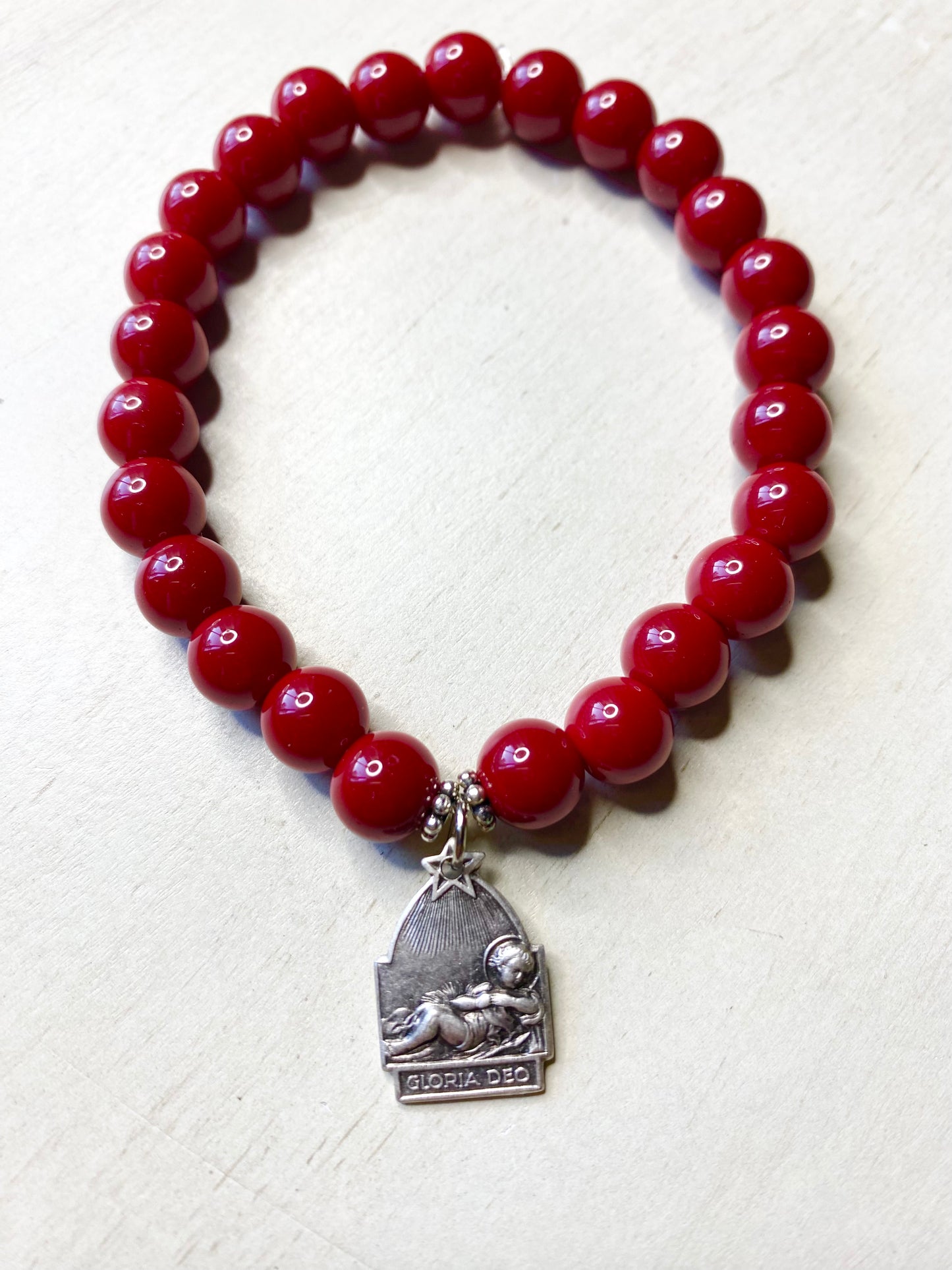 Infant Jesus Medal Stretch Bracelet with Coral Red Beads